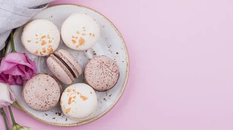 Macarons plate with roses copy space . High quality and resolution beautiful Stock Photos