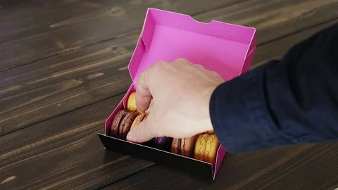 Macarons presented inside the gift box Video stock 73300362