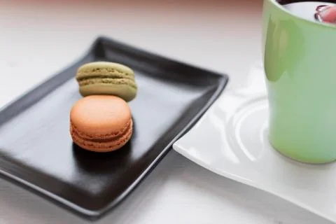 Macarons with tea. Stock Photos