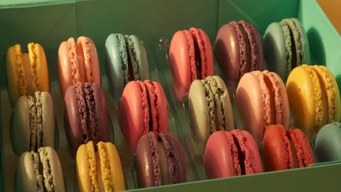 Macarons on yellow background 4K Stock Footage 124794368