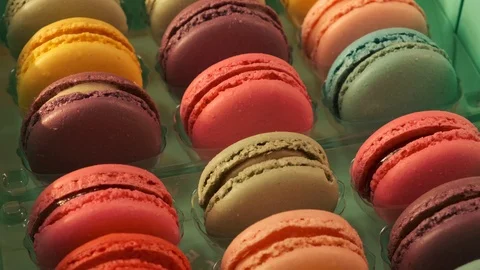 Macarons on yellow background 4K Stock Footage 124794383