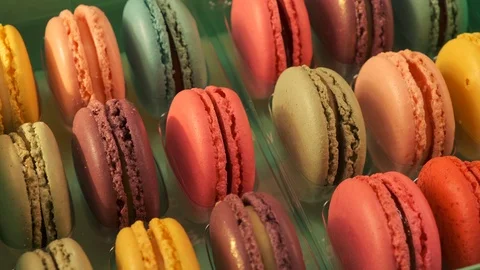 Macarons on yellow background 4K Video stock 124794428