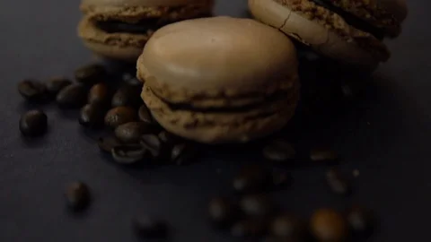 Macaroon and coffee beans on dark background 스톡 동영상 86066395