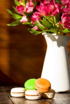 Macaroon and flowers Stock Photos