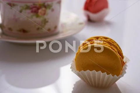 Macaroon and tea close-up on a white background Stock Photos