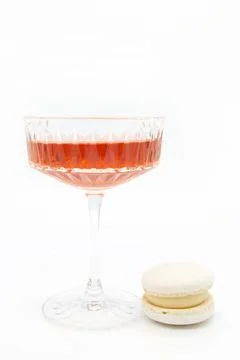 Macaroon and wine on a light background. Stock Photos