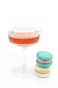 Macaroon and wine on a light background. Stock Photos