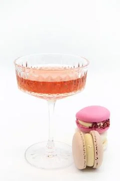 Macaroon and wine on a light background. Stock Photos