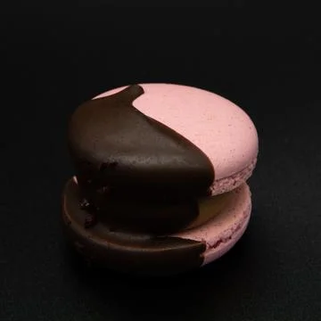 Macaroon on a black background. Stock Photos