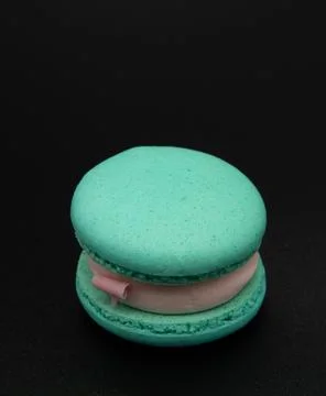 Macaroon on a black background. Stock Photos
