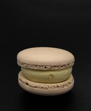 Macaroon on a black background. Stock Photos