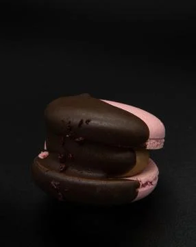 Macaroon on a black background. Stock Photos