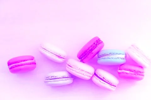Macaroon. The bright colored rolls, cookies. The background substrate. Stock Photos