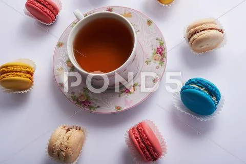 Macaroon circle and tea on a white background Stock Photos