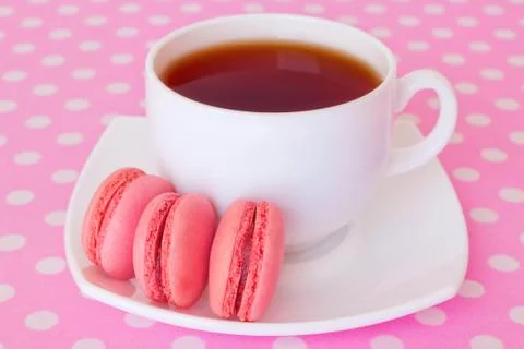Macaroon with fruit and a cup of tea Stock Photos
