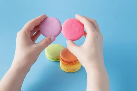 Macaroon in the hand Stock Photos