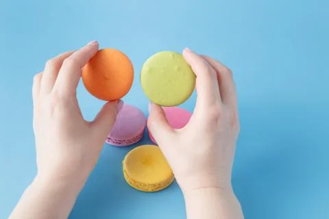 Macaroon in the hand Stock Photos