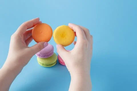 Macaroon in the hand Stock Photos