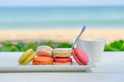 Macaroon multicolored  with a cup of coffee Stock Photos