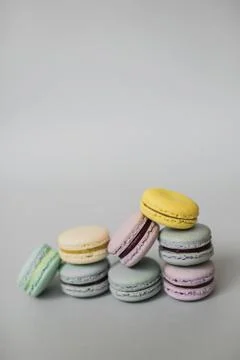 Macaroon or macaron biscuits on grey background. Stock Photos