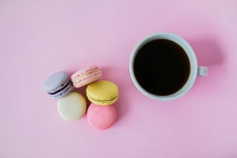 Macaroon or macaron biscuits on pink background. Stock Photos