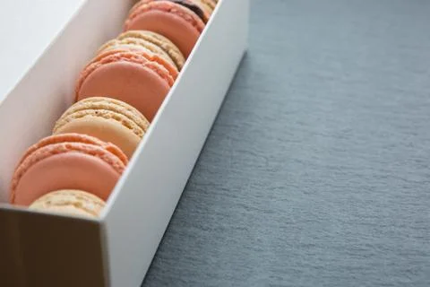 Macaroon in paper box Stock Photos