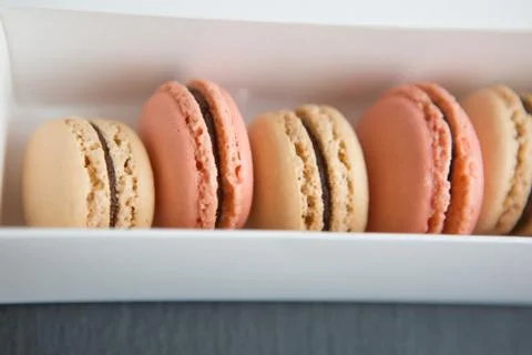 Macaroon in paper box Stock Photos