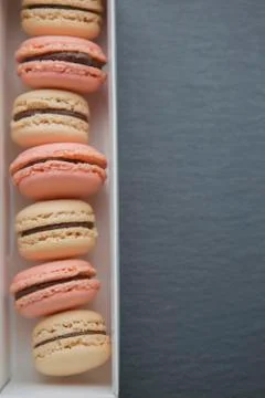 Macaroon in paper box Stock Photos
