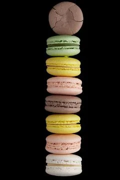 Macaroon. Stack of seven colorful cake macaron with pastel tones and one crac Stock-Fotos