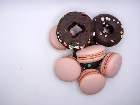 Macaroons and doughnuts Stock Photos
