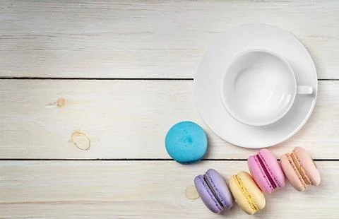 Macaroons and empty cup top view Stock Photos
