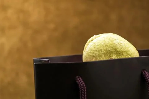 Macaroons from a black bag Stock Photos