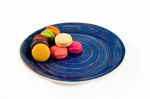 Macaroons on a blue plate Stock Photos