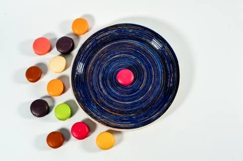Macaroons on a blue plate Stock Photos