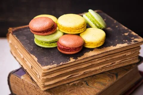 Macaroons on book Stock Photos