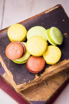Macaroons on book Stock Photos