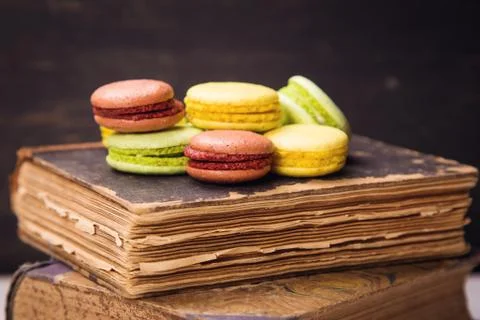 Macaroons on book Stock Photos