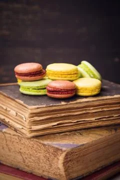 Macaroons on book Stock Photos