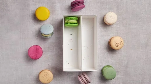 Macaroons from the box Stock Footage 146287796