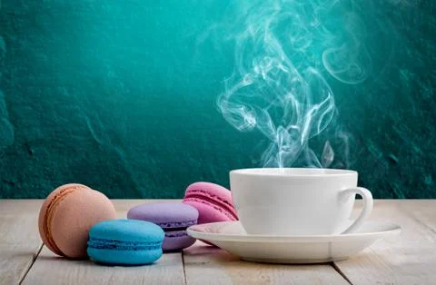 Macaroons with coffee turquoise background Stock Photos