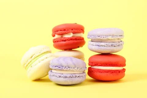 Macaroons on a colored background top view. Fotos de archivo