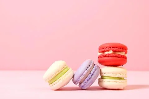 Macaroons on a colored background top view. 写真素材