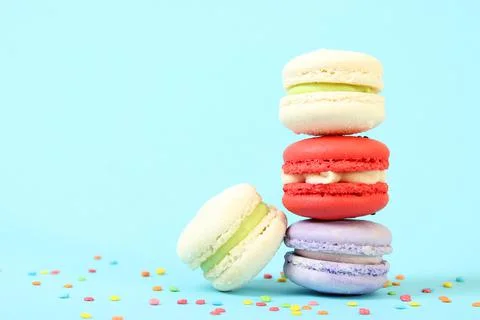Macaroons on a colored background top view. Stock Photos
