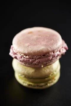 Macaroons on a dark background Stock Photos