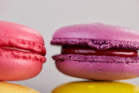 Macaroons on a dark table Stock Photos