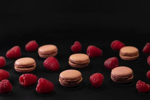 Macaroons of different colors on a black background Foto stock