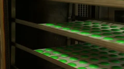 Macaroons dough goes in oven Stock Footage 11473376