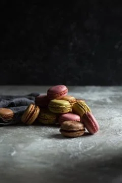 Macaroons on a gray background on a gray table Stock Photos
