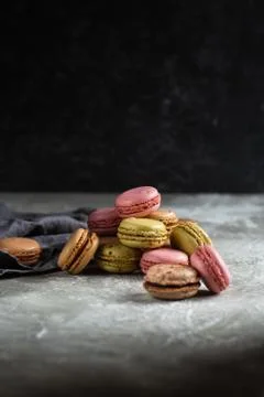 Macaroons on a gray background on a gray table Stock Photos