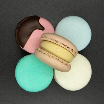 Macaroons on a grey background. Stock Photos